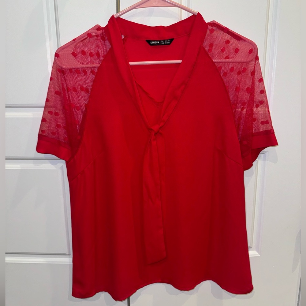 Red blouse with mesh sleeve detail